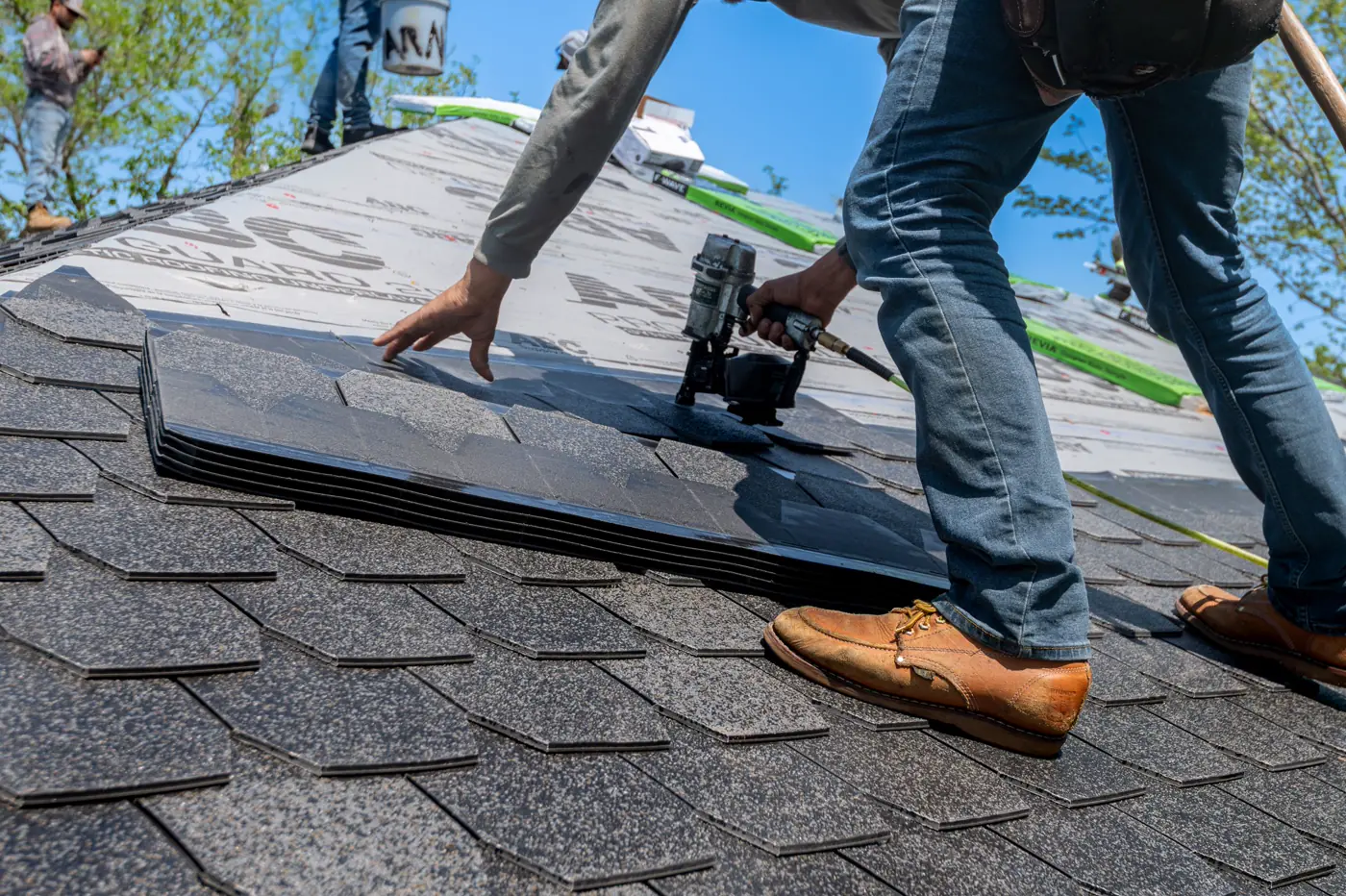 Architectural shingles being installed on a residential roof